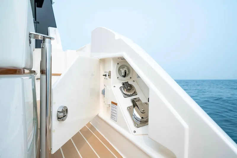 Slide: The Image of 2025 Tiara Yachts 48 LE fuel compartment by the ocean. - 29
