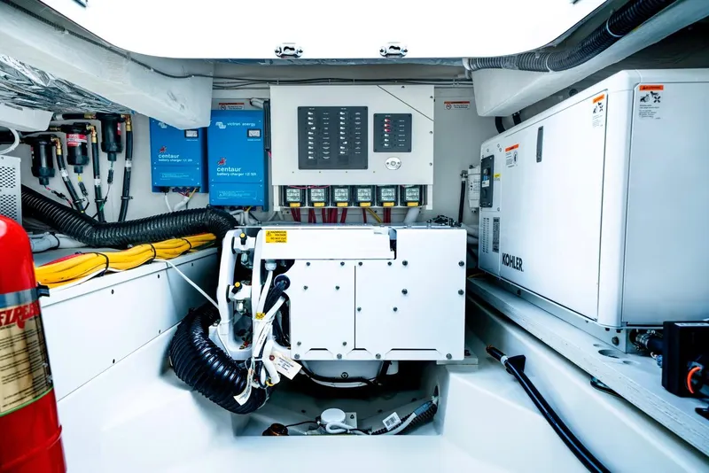Slide: The Image of Engine room of 2025 Tiara Yachts 48 LE, featuring advanced electrical systems and equipment. - 33