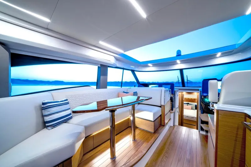 Slide: The Image of Luxurious interior of 2025 Tiara Yachts 48 LE with modern seating and panoramic windows. - 39