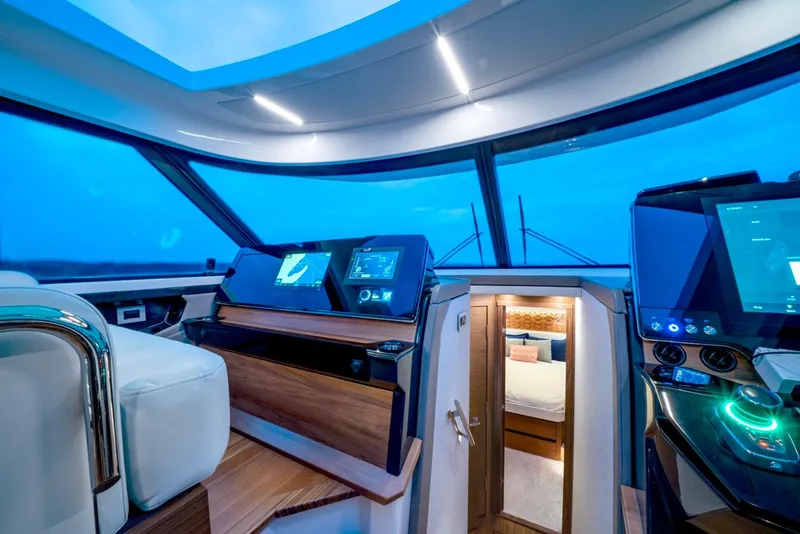 Slide: The Image of Luxurious 2025 Tiara Yachts 48 LE interior with modern navigation systems and cozy cabin. - 42