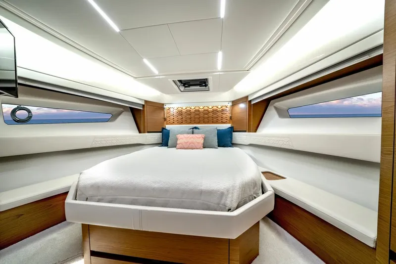 Slide: The Image of Luxurious 2025 Tiara Yachts 48 LE cabin interior with modern design and comfortable bedding. - 43