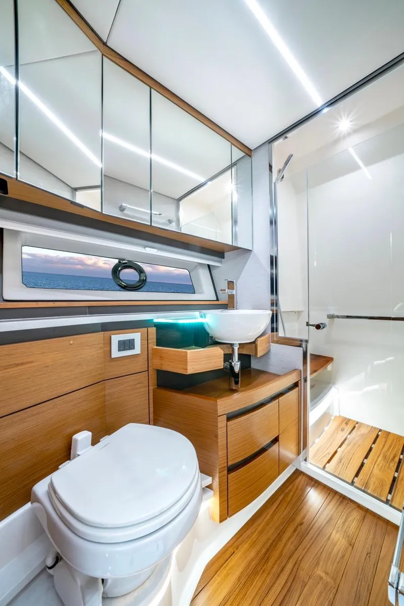 Slide: The Image of Luxurious bathroom in 2025 Tiara Yachts 48 LE, featuring modern fixtures and wood accents. - 44