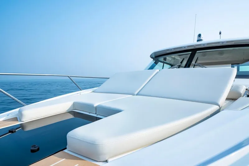 Slide: The Image of 2025 Tiara Yachts 48 LE luxury yacht with sunbathing deck on open sea. - 8