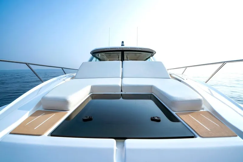 Slide: The Image of 2025 Tiara Yachts 48 LE luxury yacht with sleek deck design on calm water. - 9
