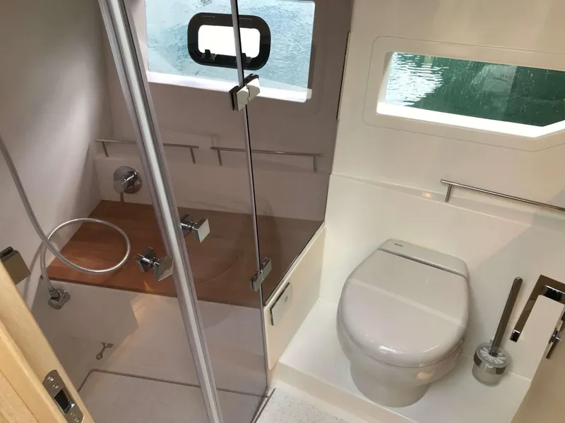 Slide: The Image of 2025 Skamander Monaco Coupe bathroom with shower, toilet, and window view. - 13