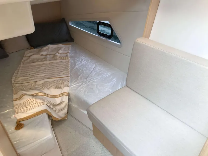 Slide: The Image of Interior cabin of 2025 Skamander Monaco Coupe with cozy bed and seating area. - 14