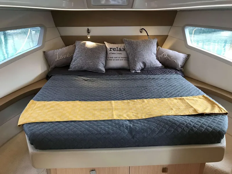 Slide: The Image of Luxurious bedroom interior of 2025 Skamander Monaco Coupe yacht with cozy bedding and pillows. - 15