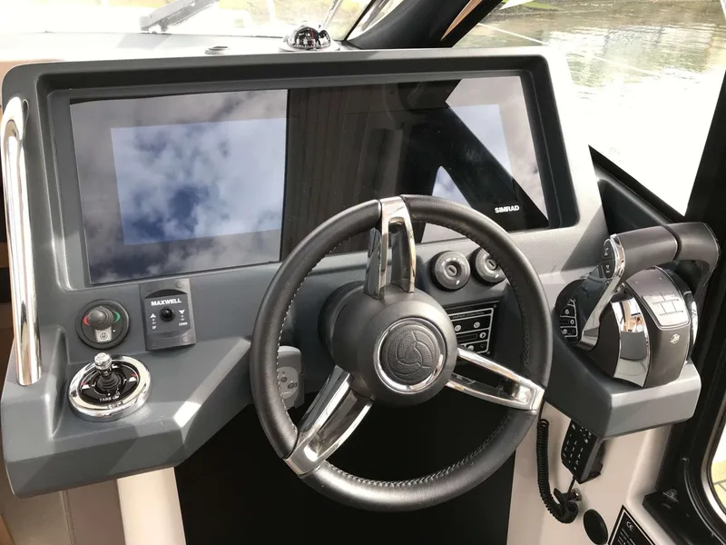 Slide: The Image of 2025 Skamander Monaco Coupe dashboard with steering wheel and modern controls. - 16
