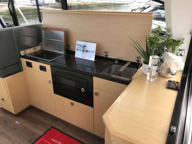 Slide: The Image of Modern kitchen interior in 2025 Skamander Monaco Coupe yacht, featuring sleek design and appliances. - 17