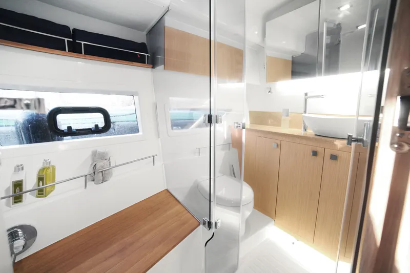Slide: The Image of Luxurious bathroom interior of 2025 Skamander Monaco Coupe with modern fixtures and wooden accents. - 18
