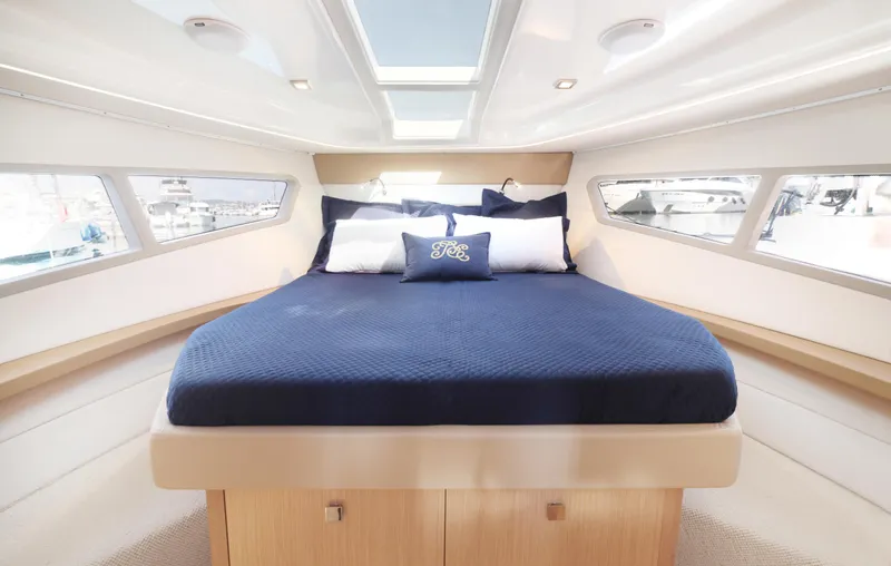 Slide: The Image of Luxurious cabin interior of 2025 Skamander Monaco Coupe yacht with elegant bedding. - 21
