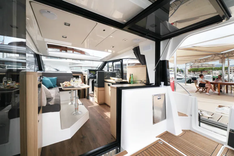 Slide: The Image of Luxurious interior of 2025 Skamander Monaco Coupe yacht with elegant dining area and modern design. - 23