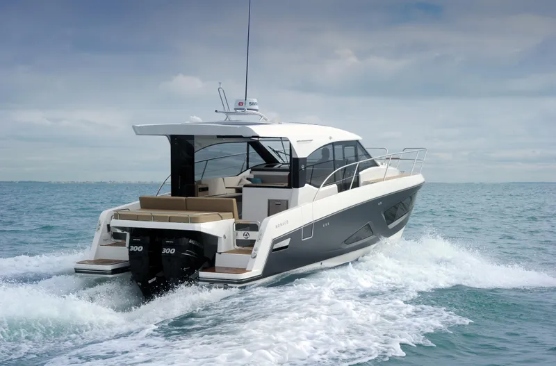 Slide: The Image of 2025 Skamander Monaco Coupe yacht cruising on open water. - 3