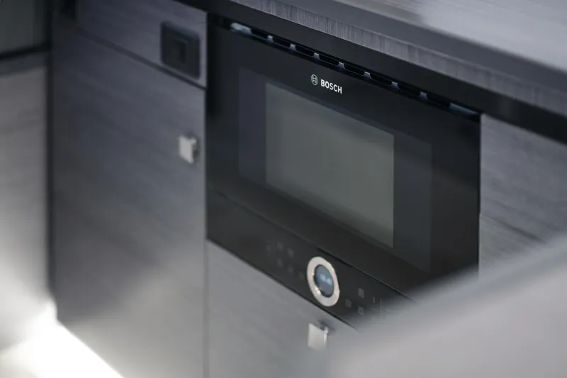 Slide: The Image of Modern Bosch microwave in Skamander Monaco Coupe 2025 interior. - 33