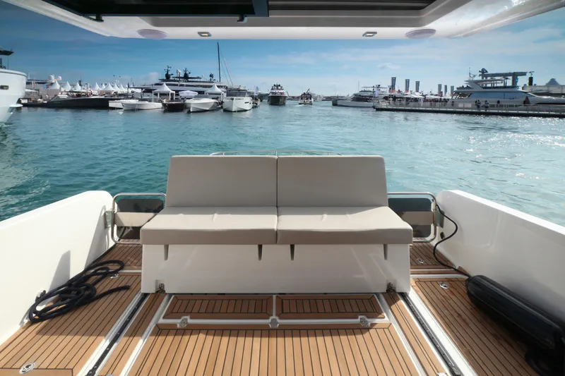 Slide: The Image of Luxury yacht interior with a view of a marina, featuring the 2025 Skamander Monaco Coupe. - 5