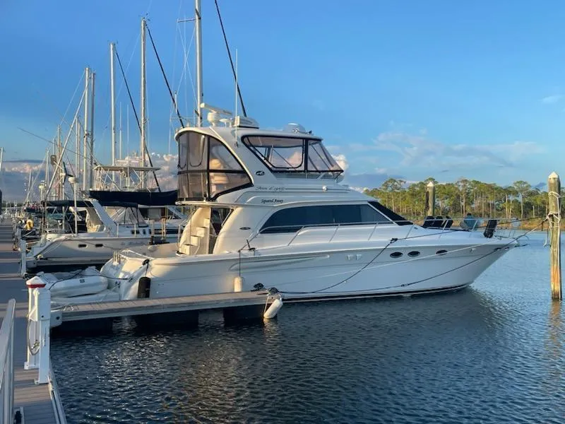 The Image of 2003 Sea Ray 480 Sedan Bridge yacht docked at marina. - 0