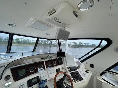Slide: The Image of Interior of 2003 Sea Ray 480 Sedan Bridge yacht cockpit with navigation equipment. - 10
