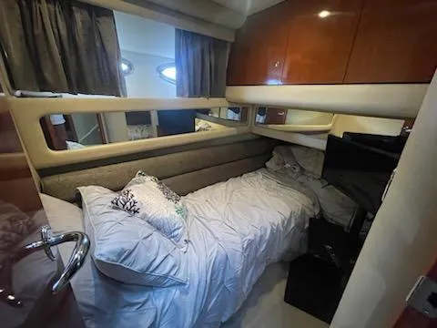 Slide: The Image of Cozy cabin interior of 2003 Sea Ray 480 Sedan Bridge yacht. - 11