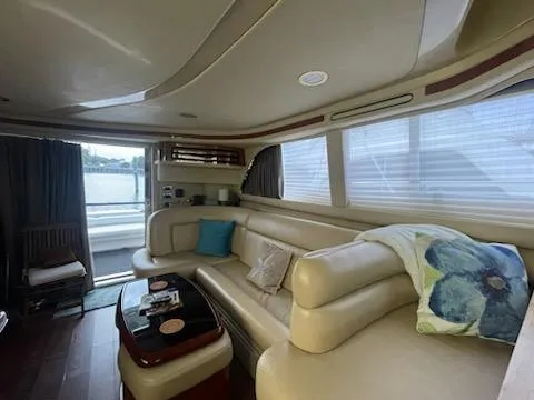 Slide: The Image of Luxurious interior of 2003 Sea Ray 480 Sedan Bridge yacht with plush seating. - 13