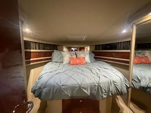 Slide: The Image of Luxurious bedroom interior of 2003 Sea Ray 480 Sedan Bridge yacht. - 16