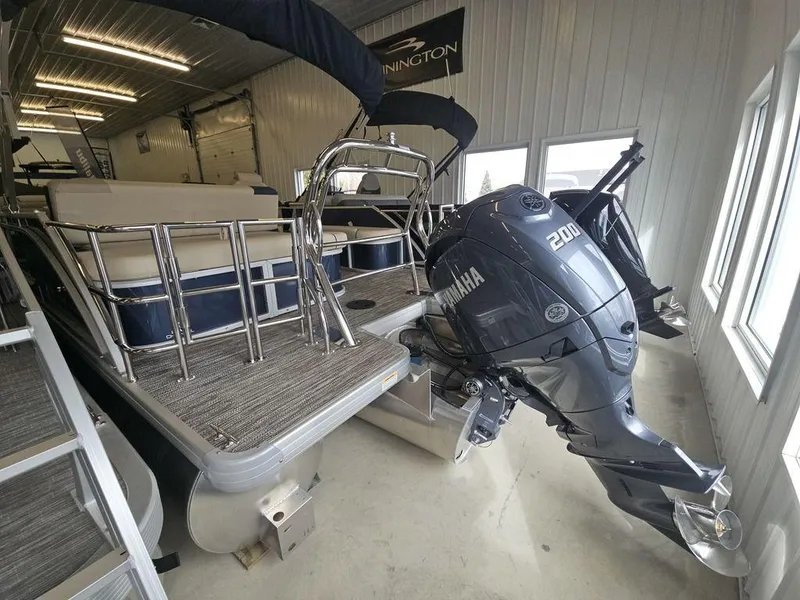 Slide: The Image of 2025 Godfrey Sweetwater 2486 SFL pontoon boat with Yamaha 200 engine in showroom. - 13