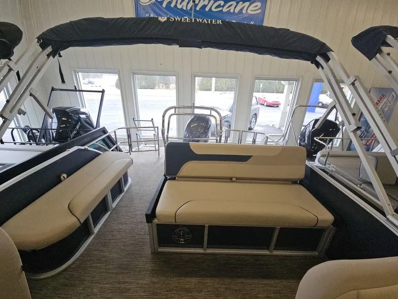 Slide: The Image of 2025 Godfrey Sweetwater 2486 SFL pontoon boat interior with seating and canopy. - 4