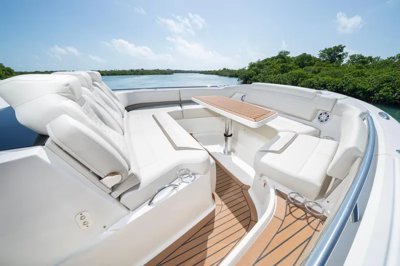 Slide: The Image of Luxurious seating area on 2025 Tiara Yachts 48 LS, featuring elegant design and scenic views. - 11