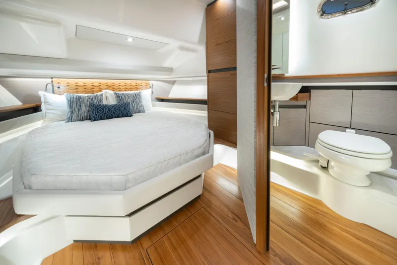 Slide: The Image of Luxurious interior of 2025 Tiara Yachts 48 LS with modern bedroom and bathroom. - 15