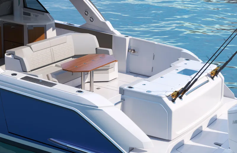 Slide: The Image of 2025 Tiara Yachts 48 LS luxury yacht deck with seating and table on blue water. - 19