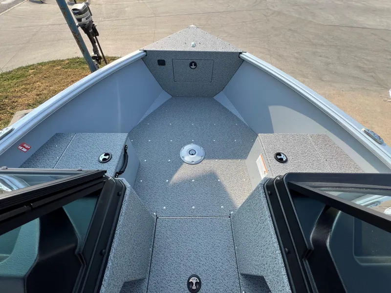 Slide: The Image of 2025 Lund 1875 Alaskan Sport boat interior with open bow and storage compartments. - 7