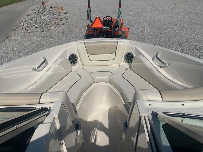 Slide: The Image of 2009 Sea Ray 230 Sundeck boat interior with spacious seating and sleek design. - 16