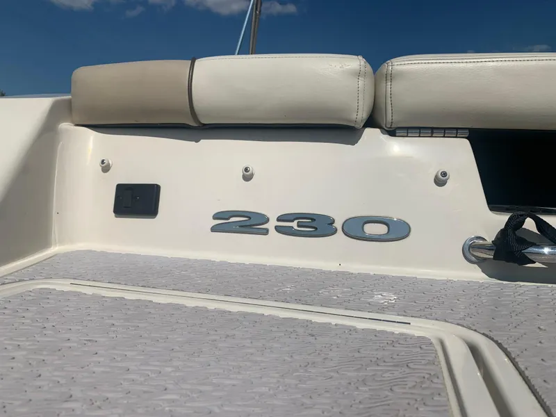 Slide: The Image of 2009 Sea Ray 230 Sundeck boat interior with seating and model number. - 20
