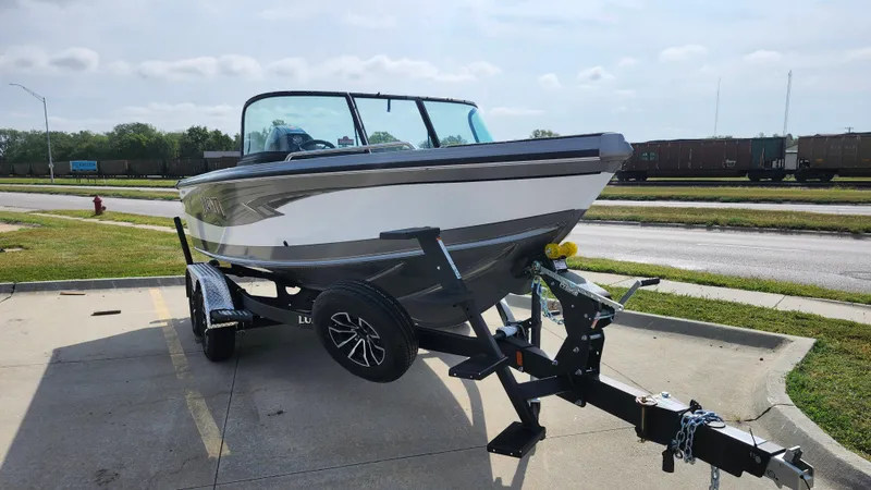 Slide: The Image of 2025 Lund 1875 Tyee boat on trailer in parking lot. - 16