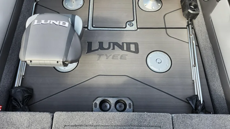 Slide: The Image of 2025 Lund 1875 Tyee boat interior with branded seat and storage compartments. - 18