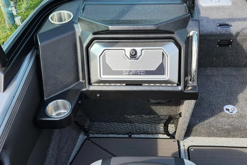 Slide: The Image of 2025 Lund 1875 Tyee boat interior with storage compartment and cup holders. - 20