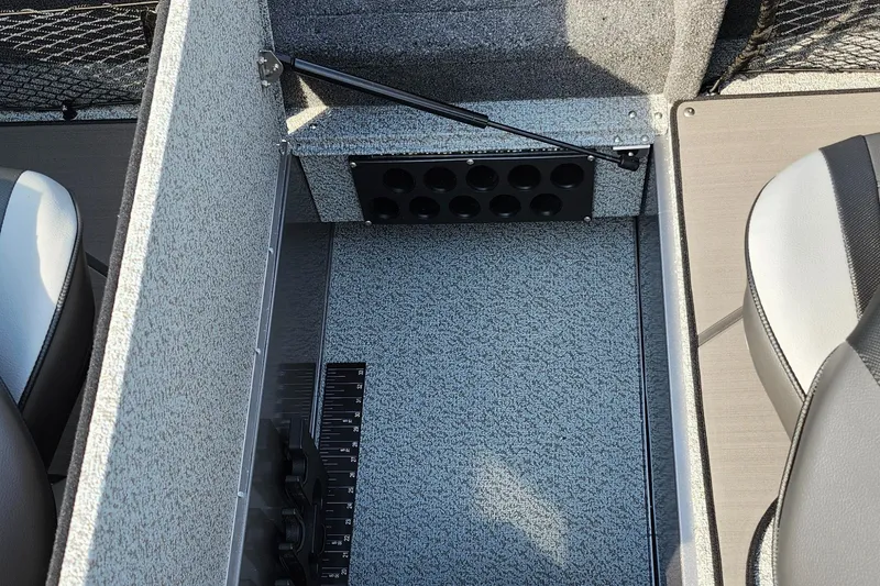 Slide: The Image of 2025 Lund 1875 Tyee boat interior with storage compartment and seating. - 23