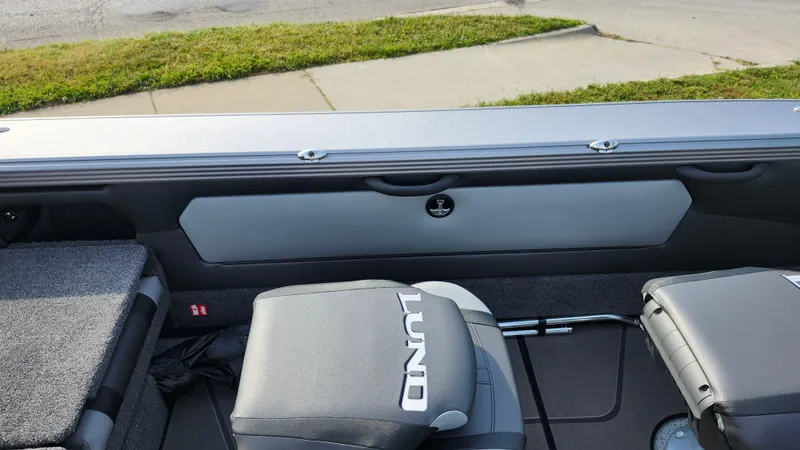 Slide: The Image of 2025 Lund 1875 Tyee boat interior with seating and storage compartments. - 7