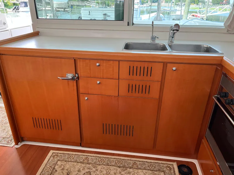 Slide: The Image of Wooden kitchen cabinetry with sink in 2007 Lagoon 420 yacht. - 14