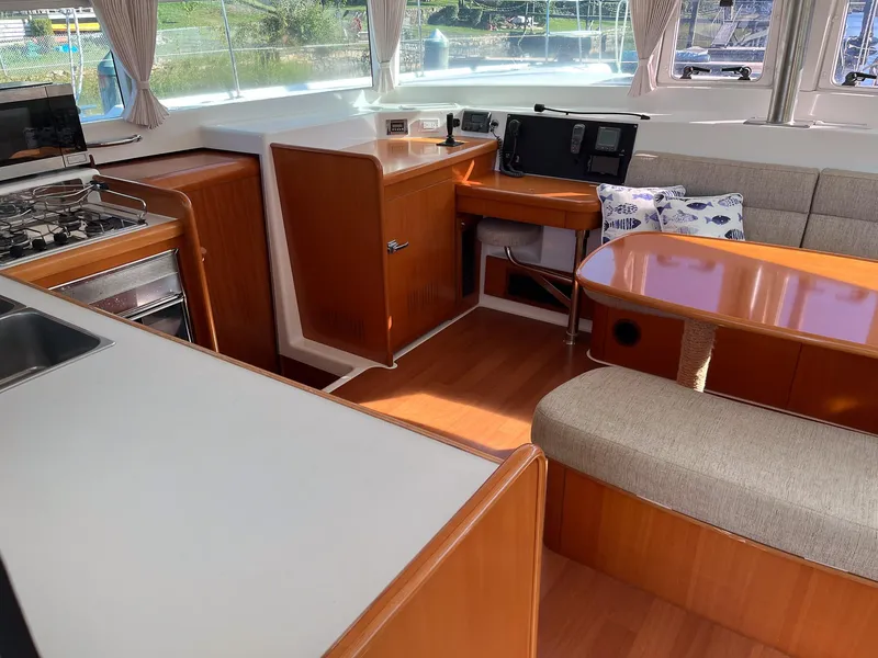 Slide: The Image of Interior of 2007 Lagoon 420 yacht with kitchen and seating area. - 18