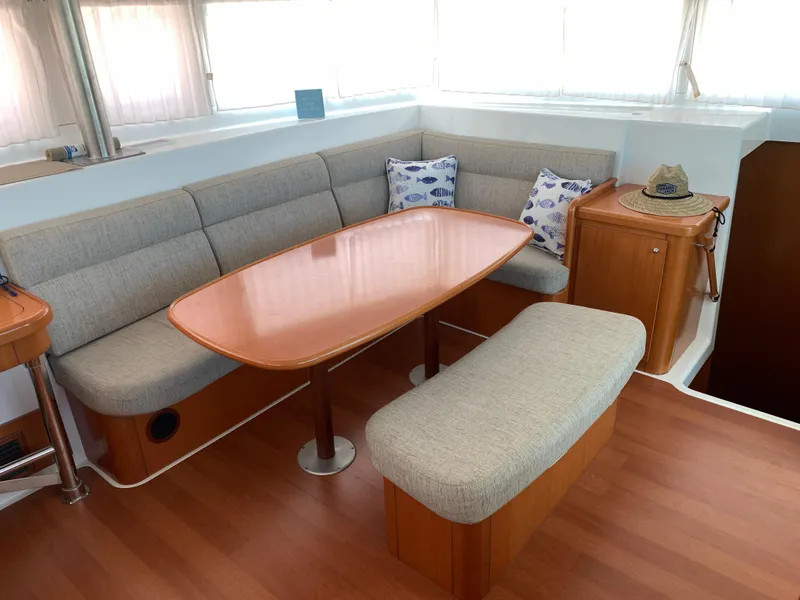 Slide: The Image of Interior of 2007 Lagoon 420 yacht with cozy seating and wooden table. - 21