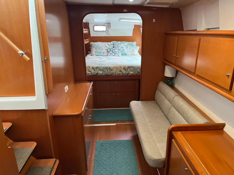 Slide: The Image of Interior of 2007 Lagoon 420 yacht with cozy bedroom and wooden furnishings. - 24