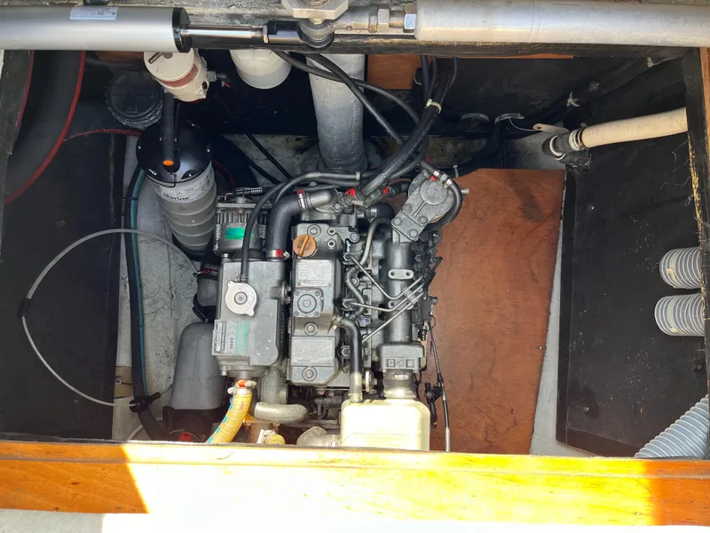 Slide: The Image of Engine compartment of a 2007 Lagoon 420 catamaran, showcasing mechanical components. - 33