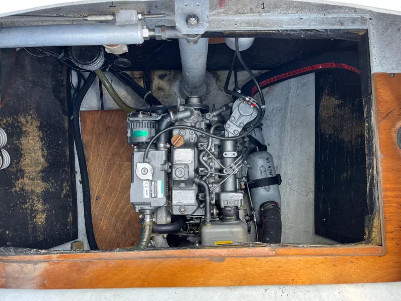 Slide: The Image of Engine compartment of a 2007 Lagoon 420 sailboat, showcasing mechanical components. - 34