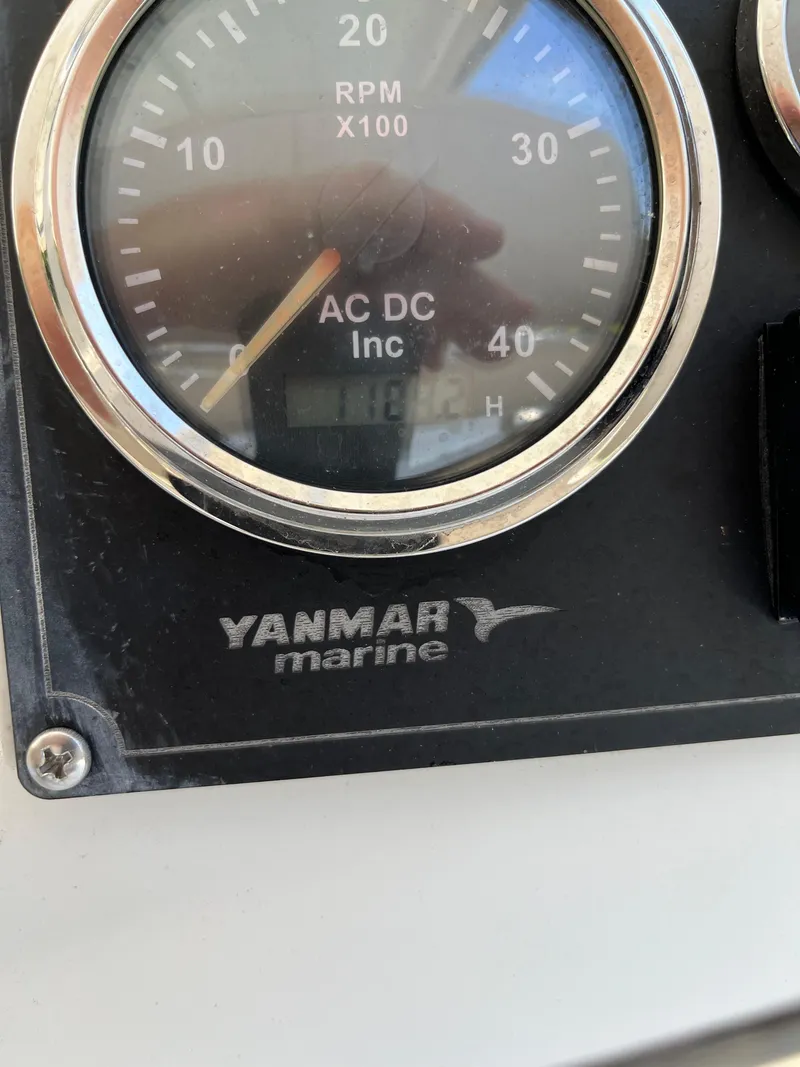 Slide: The Image of Yanmar marine gauge on 2007 Lagoon 420 catamaran, displaying RPM and hours. - 35