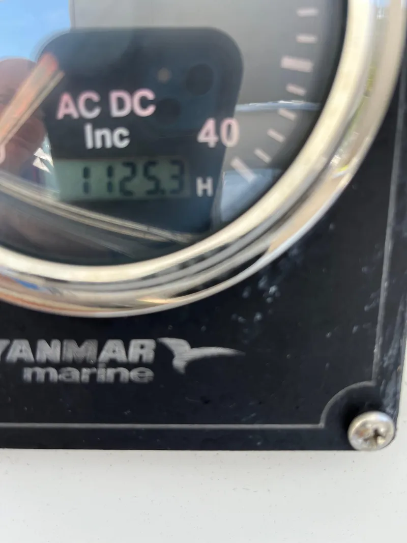 Slide: The Image of Yanmar marine gauge displaying 1125.3 hours on a 2007 Lagoon 420. - 36