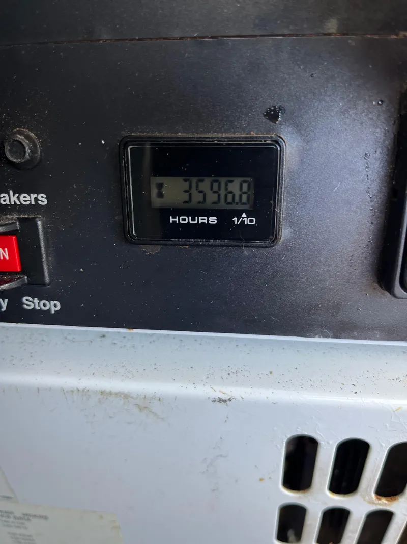 Slide: The Image of Hour meter showing 3596.8 hours on Lagoon 420, 2007 model. - 37