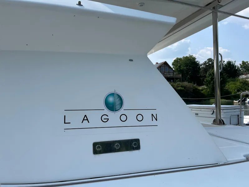 Slide: The Image of Lagoon 420 yacht, 2007 model, with logo and scenic background. - 4