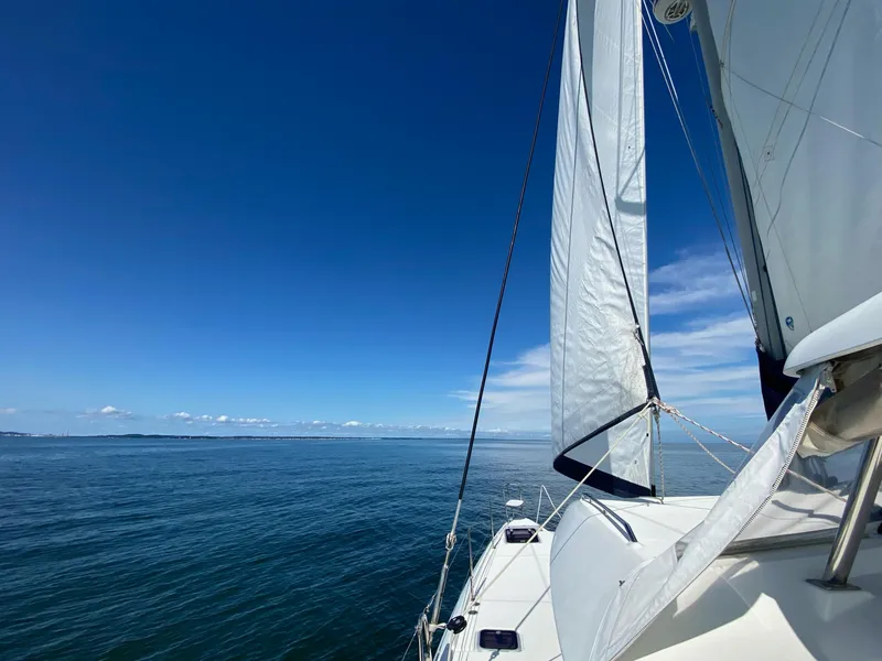 Slide: The Image of Sailing on a 2007 Lagoon 420 catamaran under clear blue skies. - 42