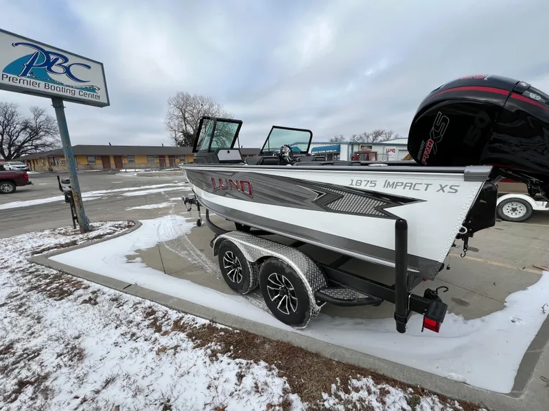 Slide: The Image of 2025 Lund 1875 Impact XS Sport boat on trailer at Premier Boating Center. - 5