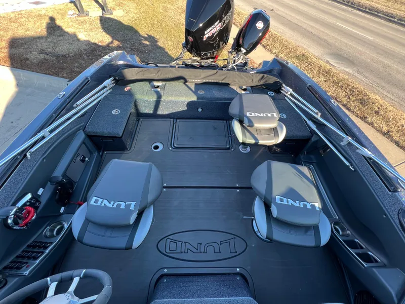 Slide: The Image of 2025 Lund 189 Pro-V GL boat interior with seating and storage compartments. - 19